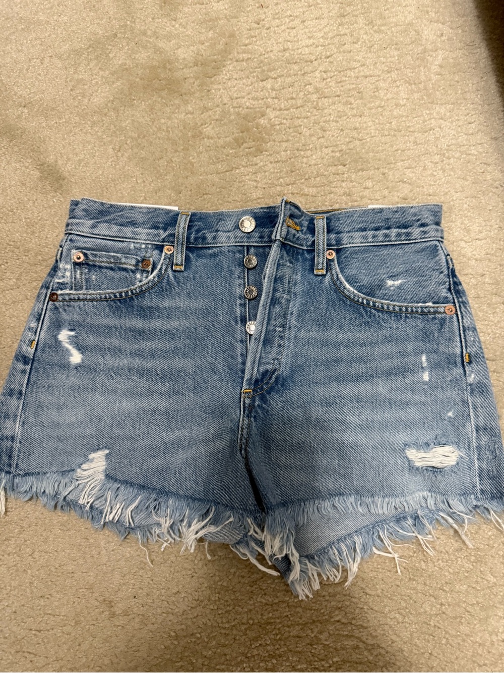 Agolde Light Blue Distressed Denim Shorts with Frayed Hem